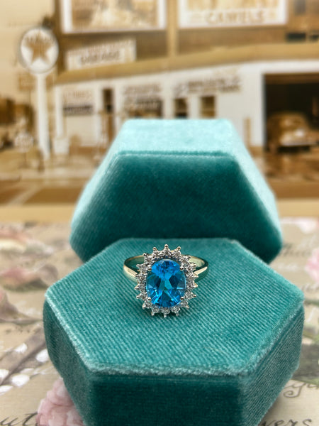 14k yellow gold blue topaz ring with diamond accents