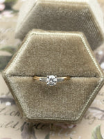 14K yellow gold diamond ring with baguette sides - 0.40 ctw